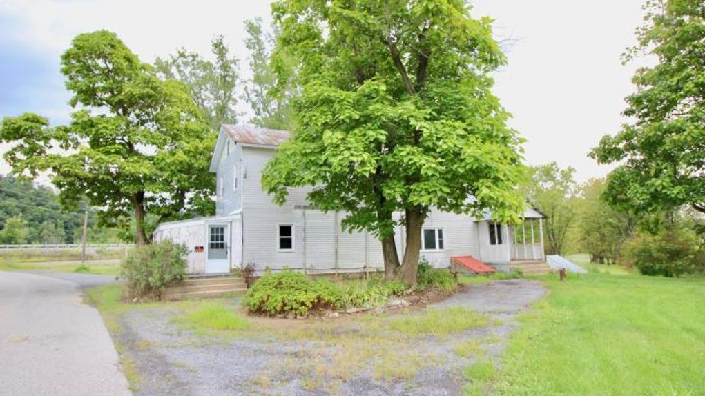 24 +/ Acres with Farm House and Outbuildings